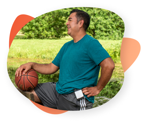 A male patient wearing the ActaStim bone growth stimulation system while playing basketball